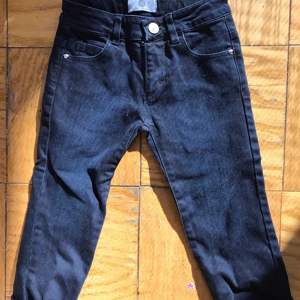 Young Versace dark colored jeans